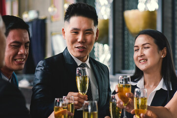 People drink celebrate at a corporate party.