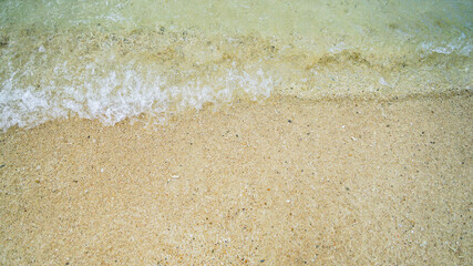 A sea of clear water with calm waves