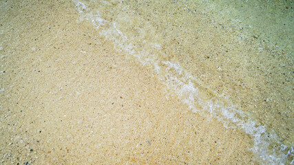 A sea of clear water with calm waves