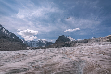 glacier mountains ice snow clouds sky drone