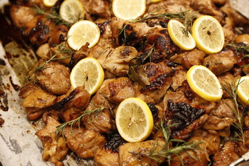 Chicken leg steak with rosemary herb and lemon.