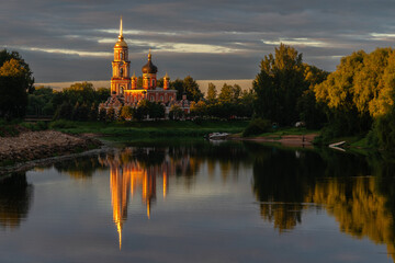 Resurrection Cathedral on the bank of the Polist River in the first rays of the summer rising sun, Staraya Russa, Novgorod Region, Russia