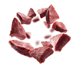 Pieces of fresh meat levitate on a white background