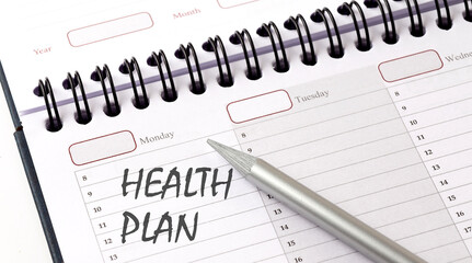 HEALTH PLAN on the planner with pencil, medicina