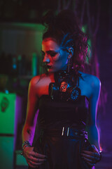 Fototapeta na wymiar girl in cyberpunk style with a gas mask and steampunk costume