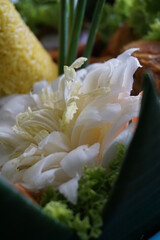Cone-shaped yellow rice is an Indonesian traditional food, called Nasi Tumapeng. A lively Indonesian rice dish with side dishes.