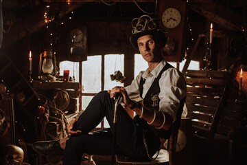 male inventor in a steampunk suit in a top hat with glasses