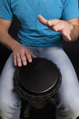 Man Playing the African Djembe Drum