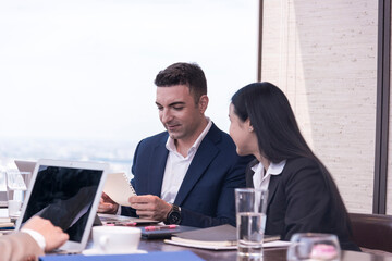 Portrait of happy businessman having meeting to success deal business at skyscraper office with cityscape business zone background