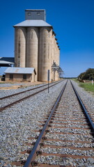 Fototapeta na wymiar The Railway Line Running Past the Silos at Mirrool NSW