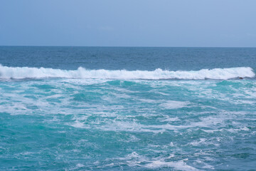 Naklejka na ściany i meble Beautiful strong blue waves in the sea.