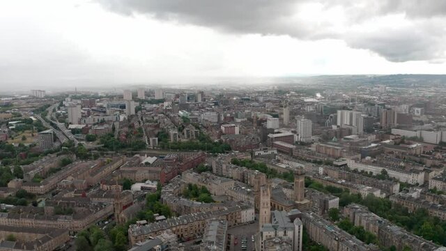 Rising dolly forward drone shot over north central Glasgow