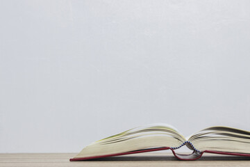 An open book on wooden background