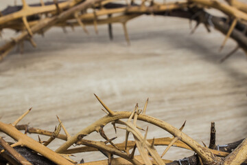 A thorn crown on a wooden table.