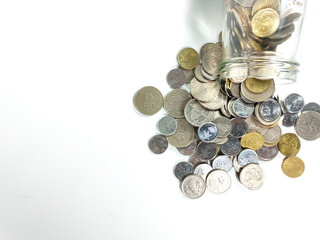 Business and Saving concept.Glass jar with coins isolated on white background with copy and text space.
