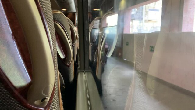 Passenger Bus view from seat when at stop for embarking disembarking