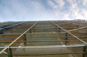 Metal scaffoldings in a building construction or renovation scene 