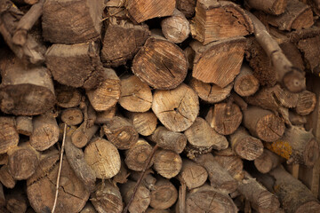 Wall old firewood, Background of dry chopped firewood logs in a pile. Preparation for the winter.