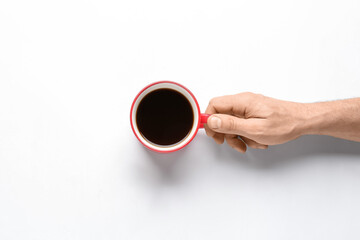 Man with cup of coffee on white background