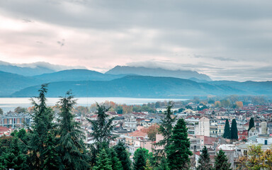 The skyline of Ioannina city in Epirus, Greece, with the lake Pamvotis and Mitsikeli Mount in the background.