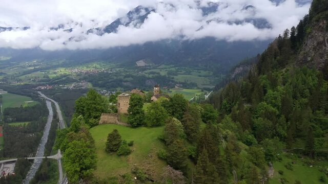Aerial drone footage of the ruins of the Hohenr&auml;tien hilltop castle near Thusis in canton Graubunden in Switzerland