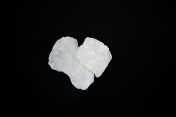 Alum stone isolated on black background..
