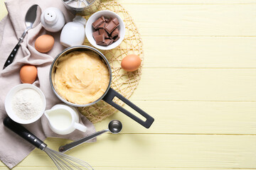 Ingredients for preparing churros on color wooden background