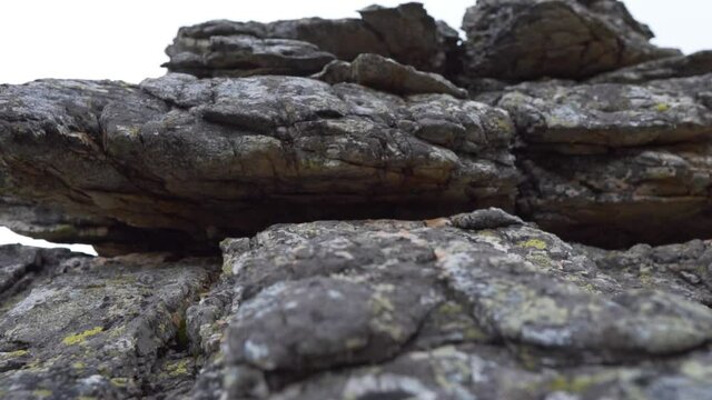 Mountain Stones Standing On Each Other, Close-up. The Structure and Texture of the Stone Rock Consisting of Ancient Layers