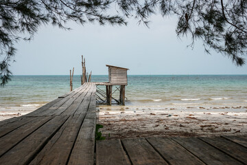small wooden pier at the virgin beach is simple and human made still function until now 