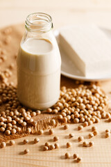 soy milk in a bottle on wooden table