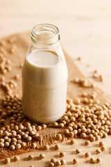 soy milk in a bottle on wooden table