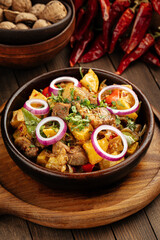 Georgian dish lamb ojahuri with potato stew in a bowl