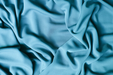 Smooth elegant blue satin texture abstract background. Luxurious background design.