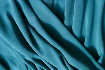 Smooth elegant blue satin texture abstract background. Luxurious background design.