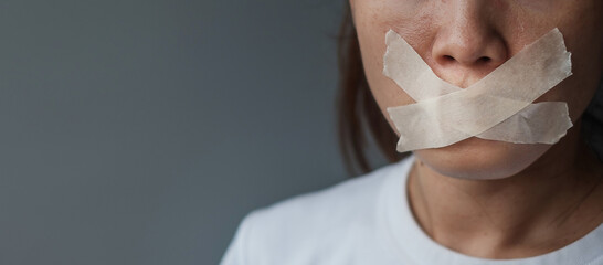 woman with mouth sealed in adhesive tape. Free of speech, freedom of press, Human rights, Protest dictatorship, democracy, liberty, equality and fraternity concepts