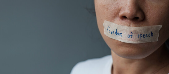 woman with mouth sealed in adhesive tape with Freedom  of Speech message., freedom of press, Human...