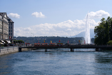 River Rhone at City of Geneva with bridges in the background on a sunny summer morning. Photo taken July 29th, 2021, Geneva, Switzerland.