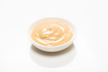 Mushroom sauce in a bowl isolated on white background.