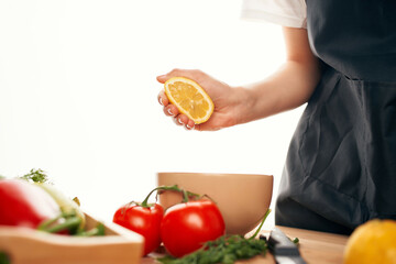 lemon in hand kitchen cutting vegetables salad cooking