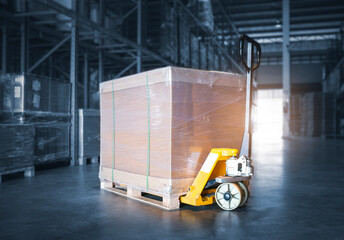 Package Box with Hand pallet Truck Load in Storage Warehouse. Storehouse, Shipping Warehouse...