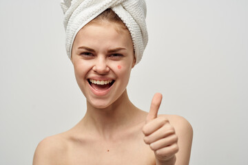 pretty woman with a pimple on the face dermatology isolated background