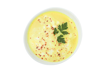 Plate of pumpkin soup isolated on white background