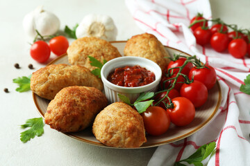 Concept of tasty food with cutlets on white textured table