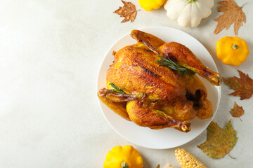 Thanksgiving Day roast turkey on white textured table