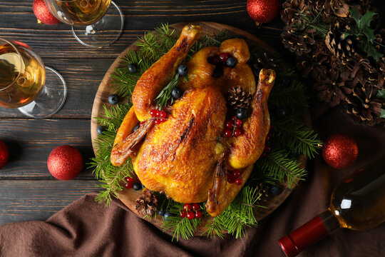 Concept of Christmas roast turkey on wooden table