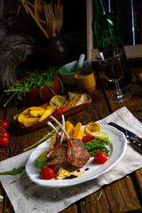 Lamb chops marinated in herbs with green asparagus and lime