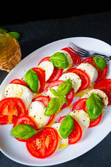 Tomato with mozzarella and basil