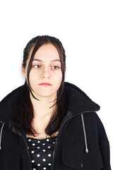 Hispanic teenage woman wearing black sheep jacket on white background. Fashion concept