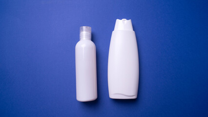 shampoo or hair conditioner bottle isolated on blue background