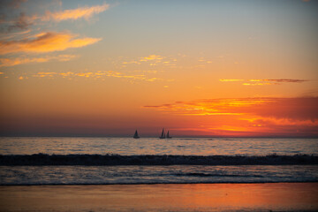 Ocean sunset on sky background with colorful clouds. Calm sea with sunrise sky.